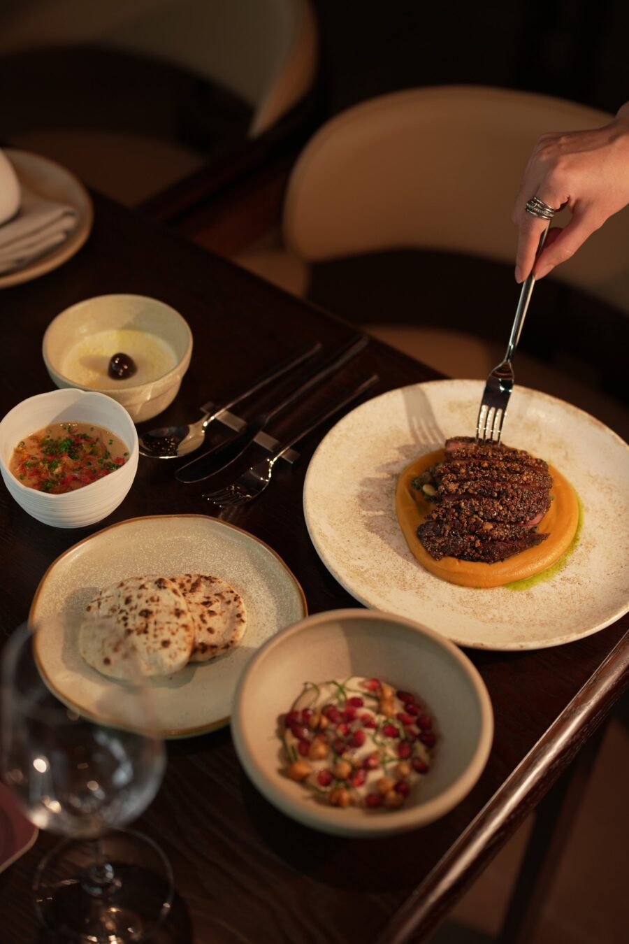 Woodfire-grilled dish served with banchan, Liora