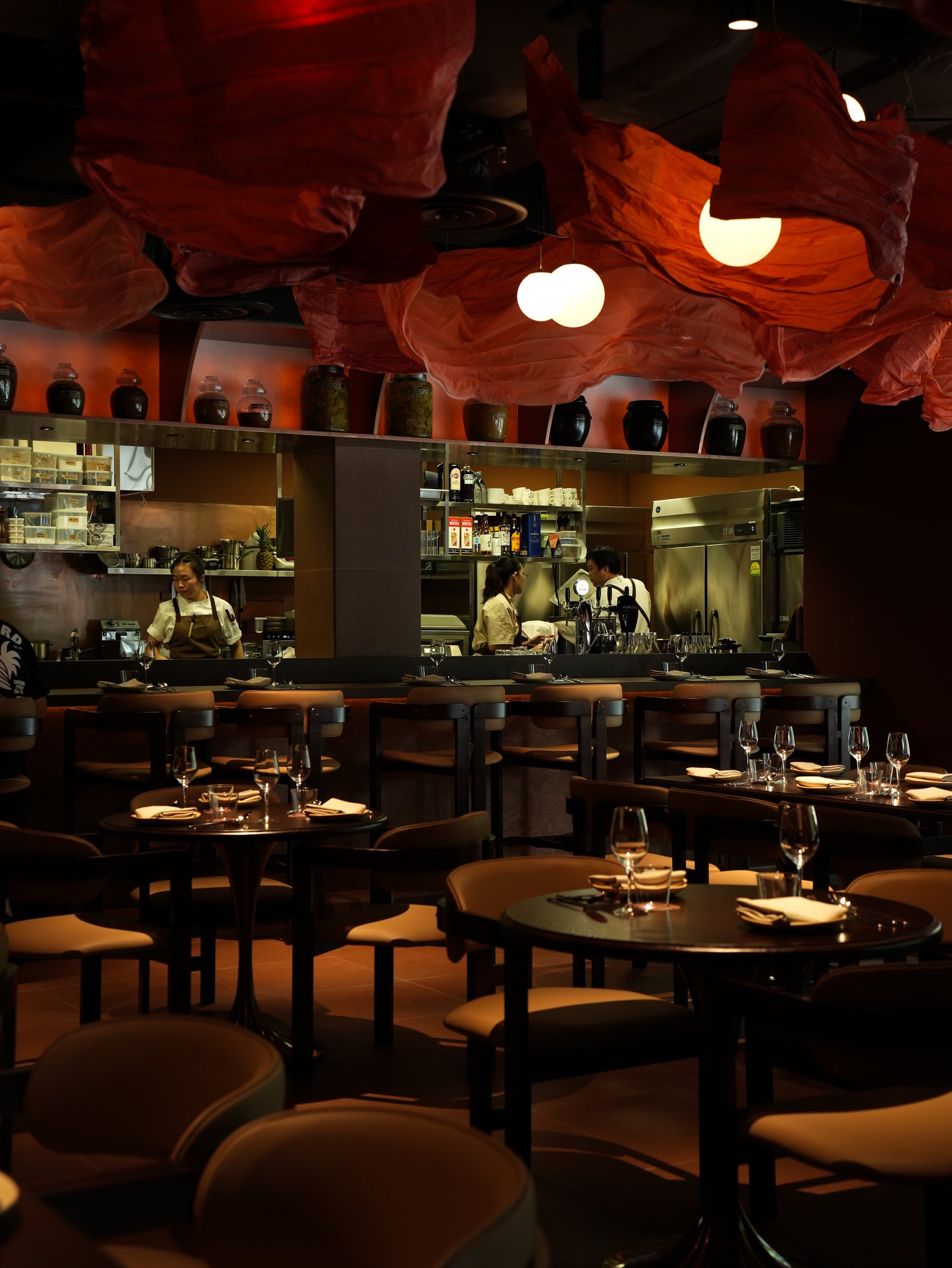 The main dining room and open kitchen at Liora