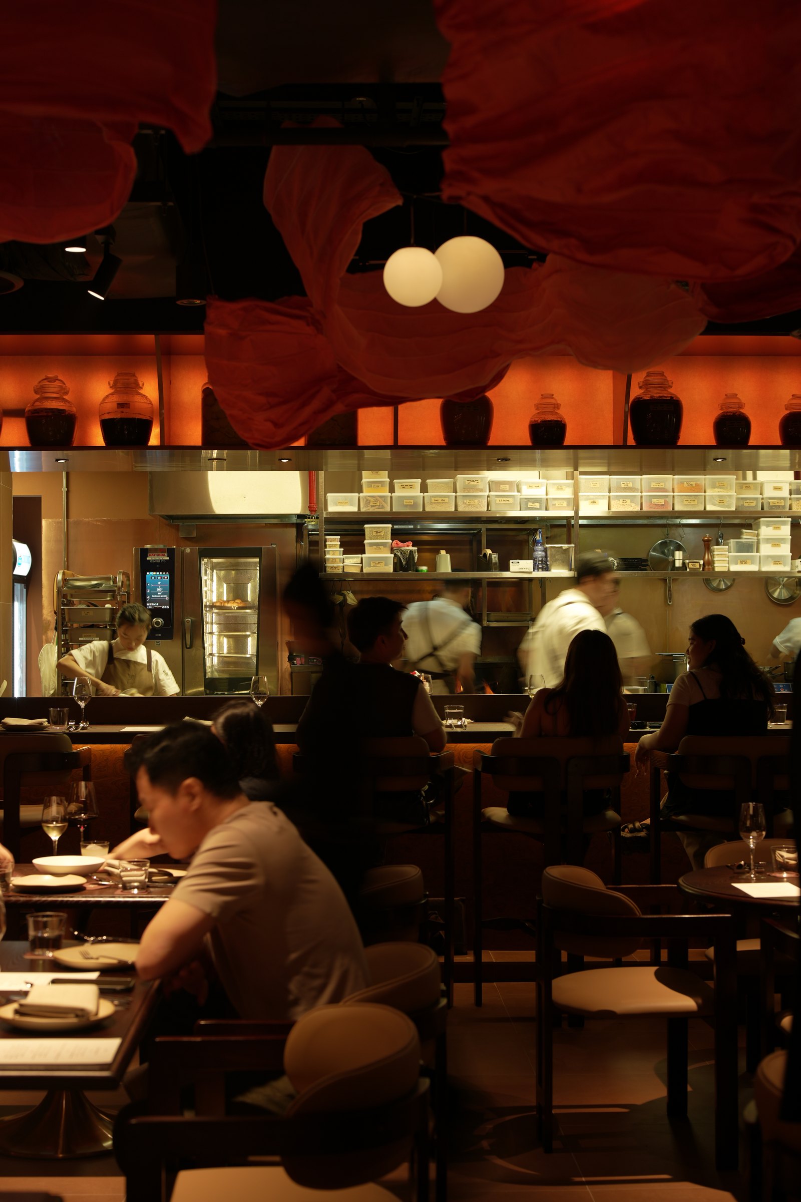 The dining room at Liora, lit for the evening